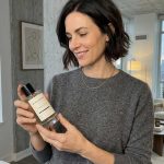 Black Stripe female customer with black stripe bottle
